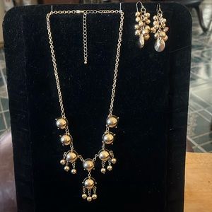 Unique vintage gold tone necklace with almost matching earrings to make the set